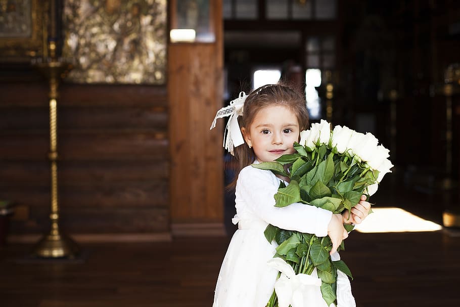 girl, white, dress, holding, roses bouquet, inside, brown, room, beautiful, flowers