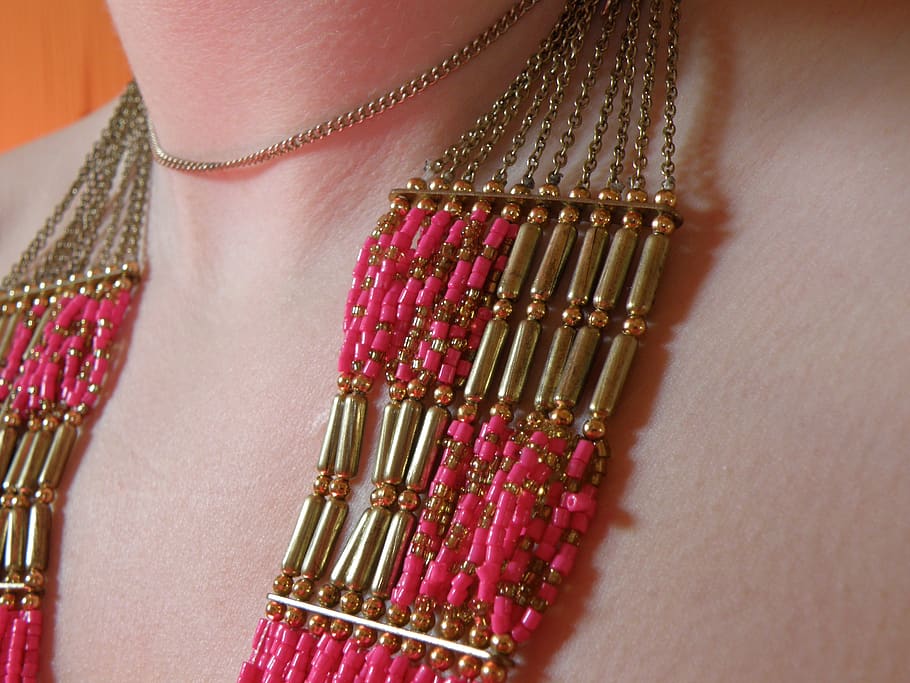 jewelry, pink, beads, gold, necklace, chain, one person, close-up, midsection, human body part