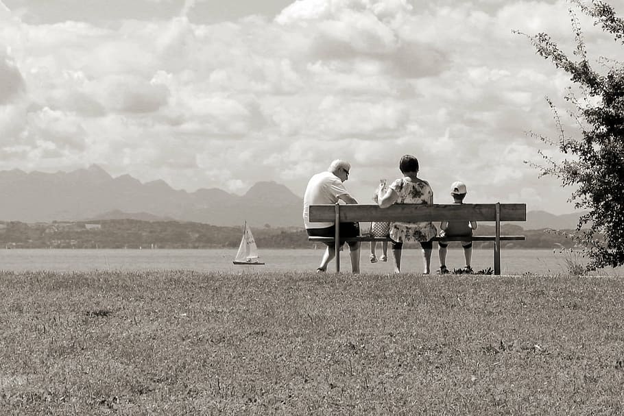 family, sitting, bench infront, sea, holiday, leisure, parents, children, togetherness, nature