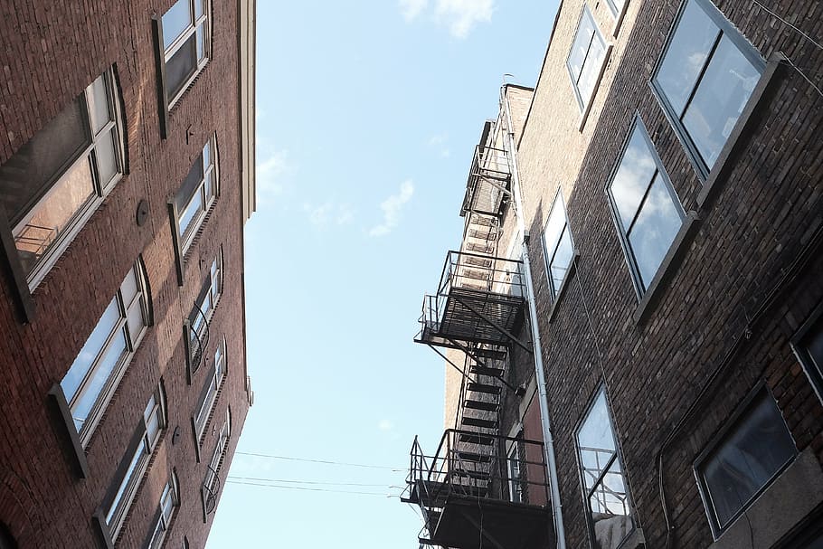 low, angle photography, building, brown, buildings, houses, apartments, windows, fire escape, stairs