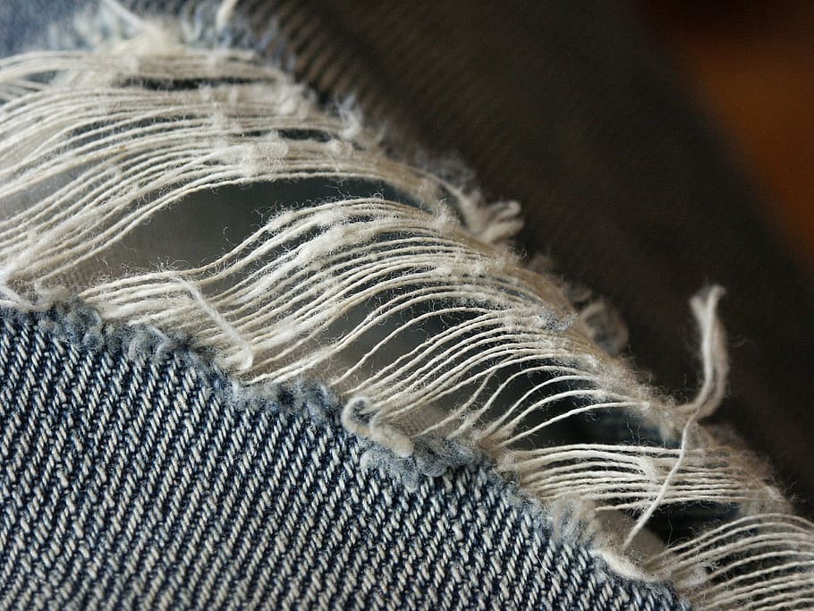 blue textile, sewing, jeans, thread, ripped, pants, needle, textile, close-up, indoors