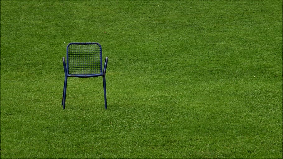 black, metal armchair, grass field, chair, rush, grass, quiet zone, time out, break, green