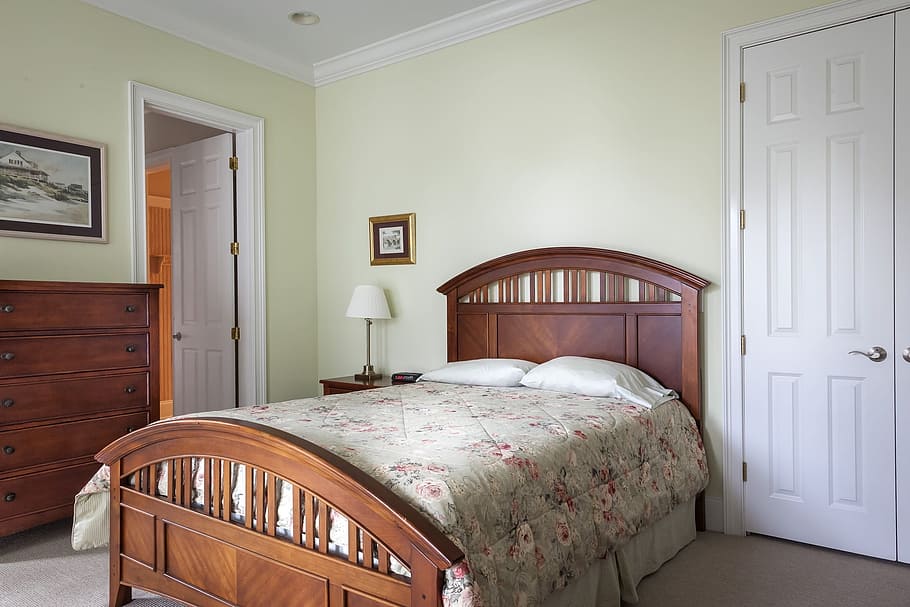 brown, wooden, panel bed, gray, pink, floral, bedspread, white, 6-panel, 6- panel door