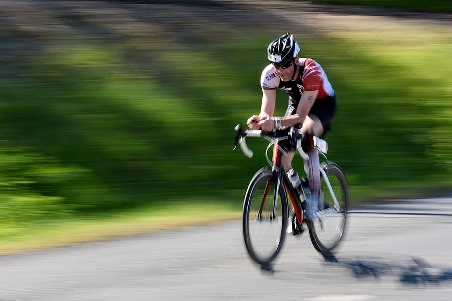 cyclist, man, riding, bicycle, daytime, cycling, sport, speed, activity, blurred motion