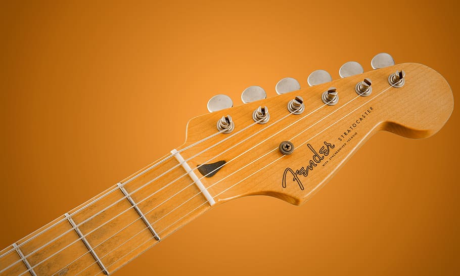 brown, fender guitar head, guitar, music background, background, music, colored background, arts culture and entertainment, string instrument, musical instrument