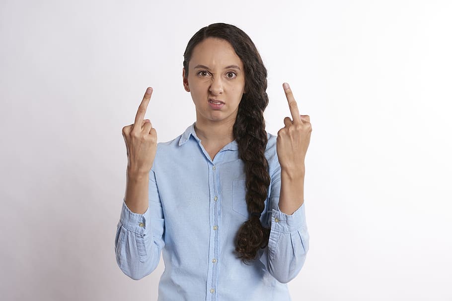 woman, wearing, blue, dress shirt, showing, middle finger, upset, person, flicking off, unhappy