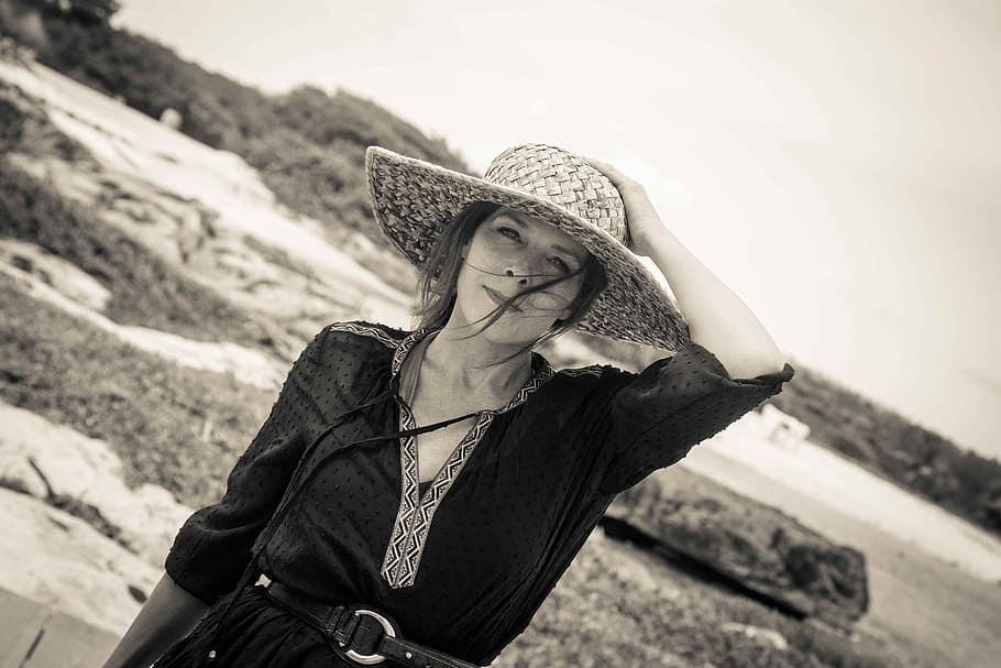 grayscale photo, woman, holding, hat, woman with straw hat, woman at the beach, vacations, riviera maya, fifty and fabulous, fashion