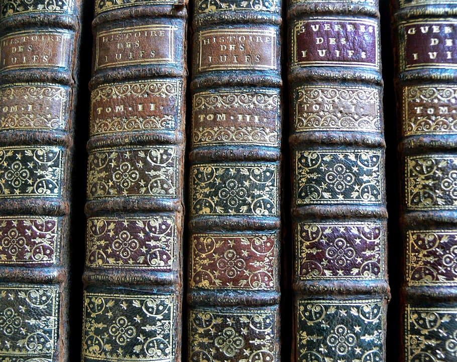 showing, four, hard, case books, hard case, books, old, reading, antique, back of a book