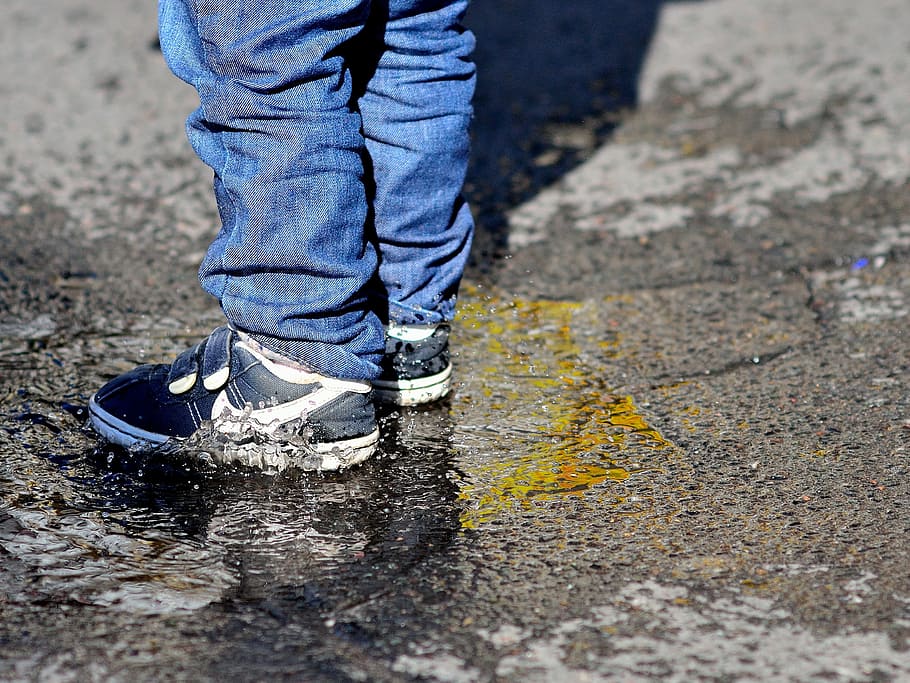 person, wearing, black-and-white, nike velcro sneakers, children's feet, puddle, splash, fun, play, wet