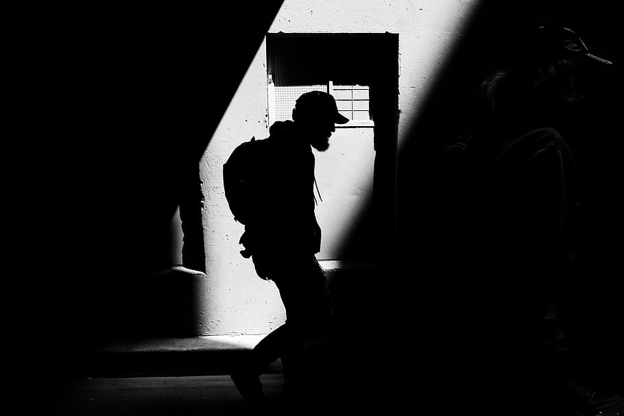 silhouette photo, person, structure, dark, people, man, guy, walking, silhouette, light