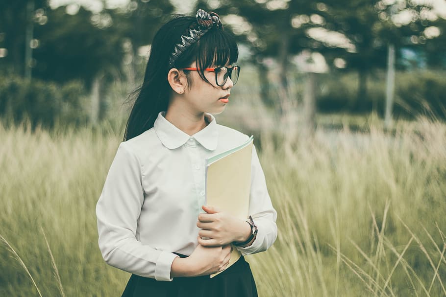 girl, wearing, white, button-up uniform, daytime, asian, blur, book, child, fall