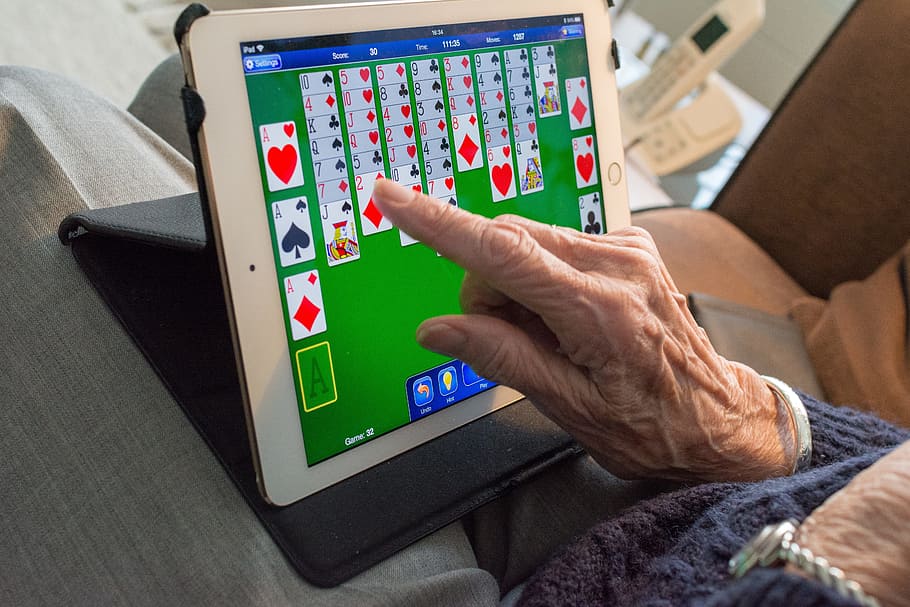 person, playing, solitaire, white, ipad, computer, technology, laptop, people, adult