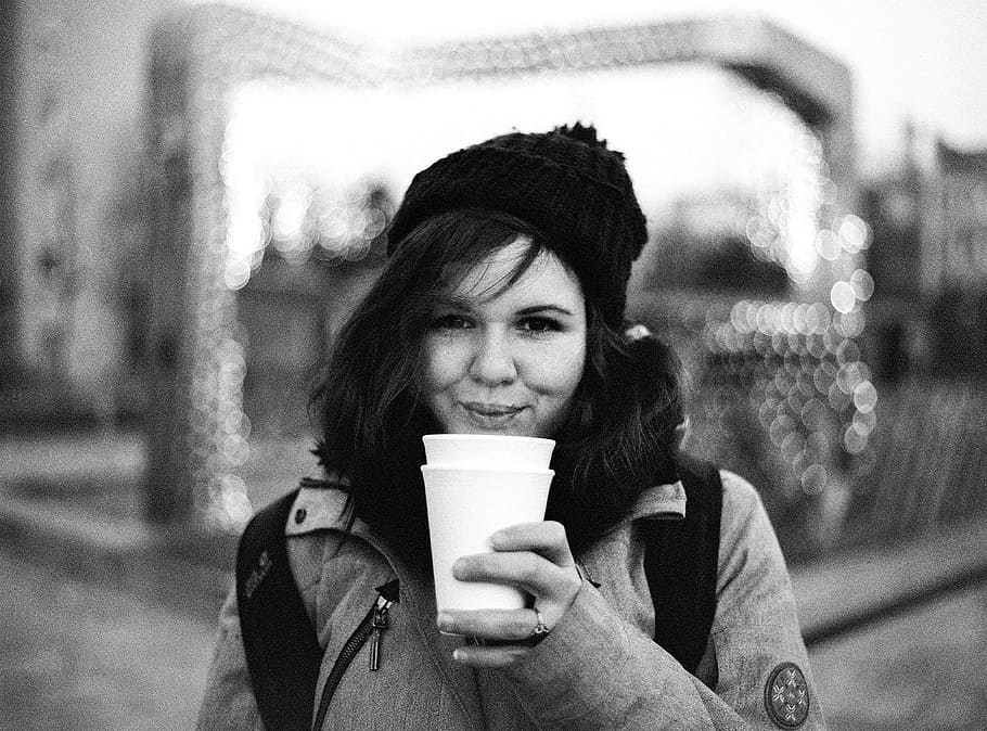 grayscale photography, woman, blowing, white, cup, winter, girl, drinking, hot, tea