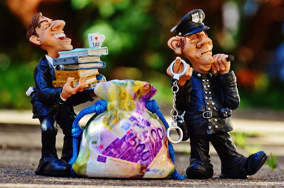two, police man, ceramic, figures, taxes, tax evasion, police, handcuffs, scam, tax consultant