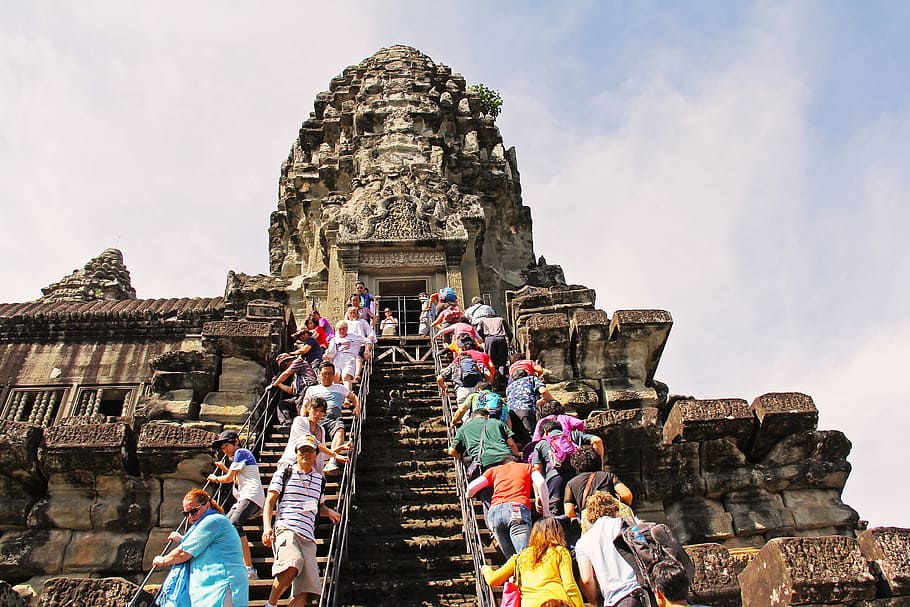 people, climbing, brown, ancient, tower low-angle photography, daytime, angkor wat temple, amazing, seven wonders, wonder