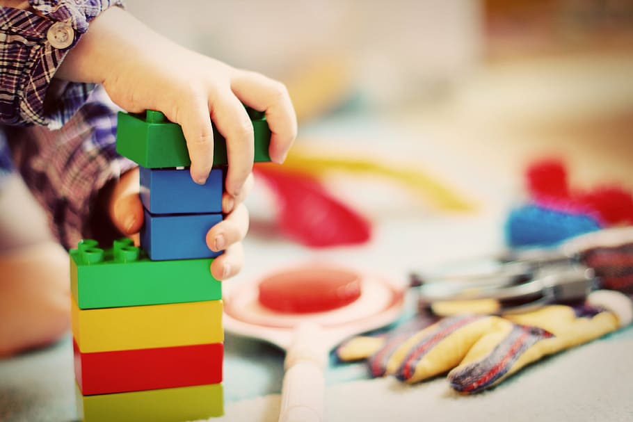 person, holding, lego blocks, child, tower, wooden blocks, kindergarten, play, toys, children