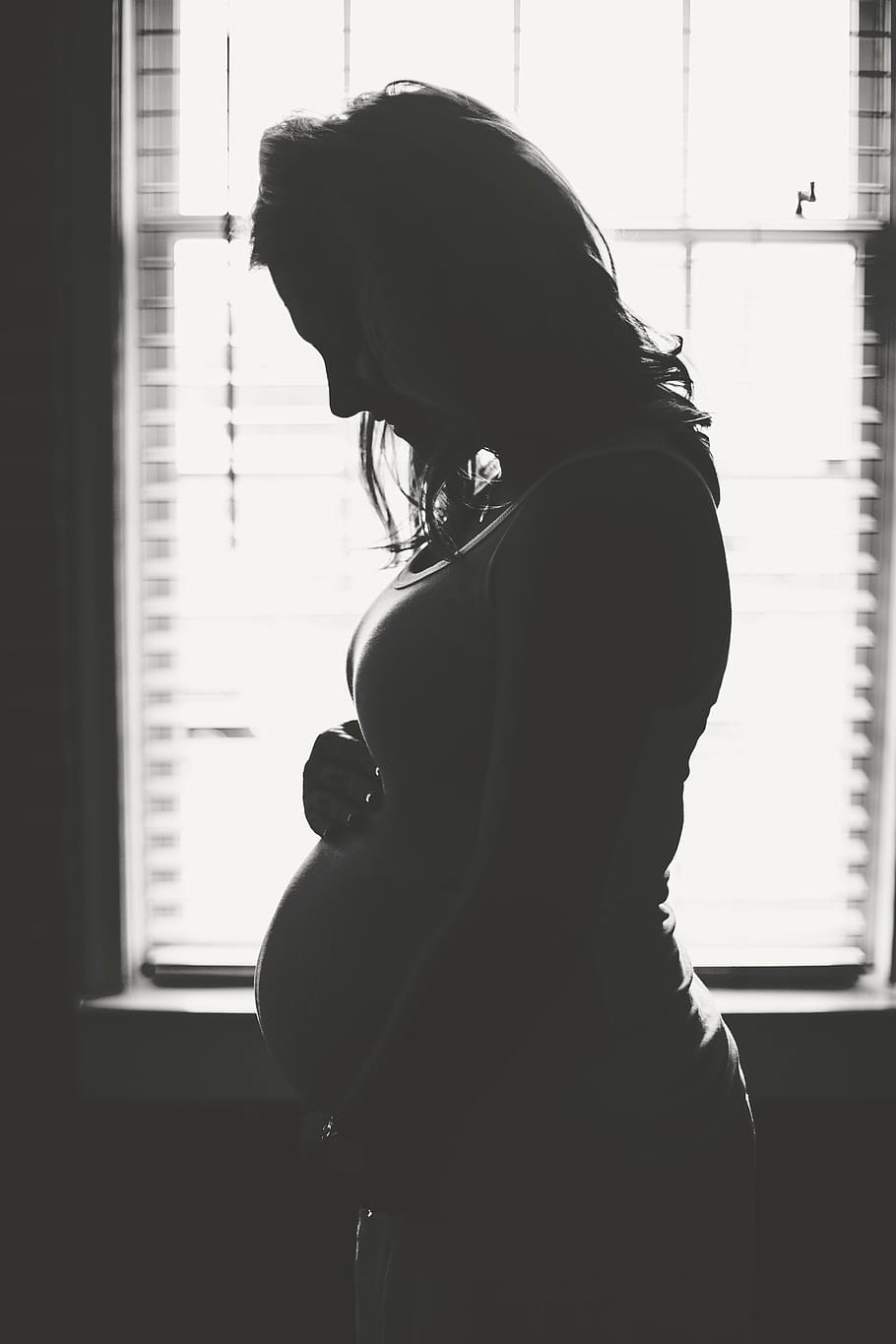 grayscale photography, pregnant, woman, window, mother, female, belly, expecting, silhouette, backlight