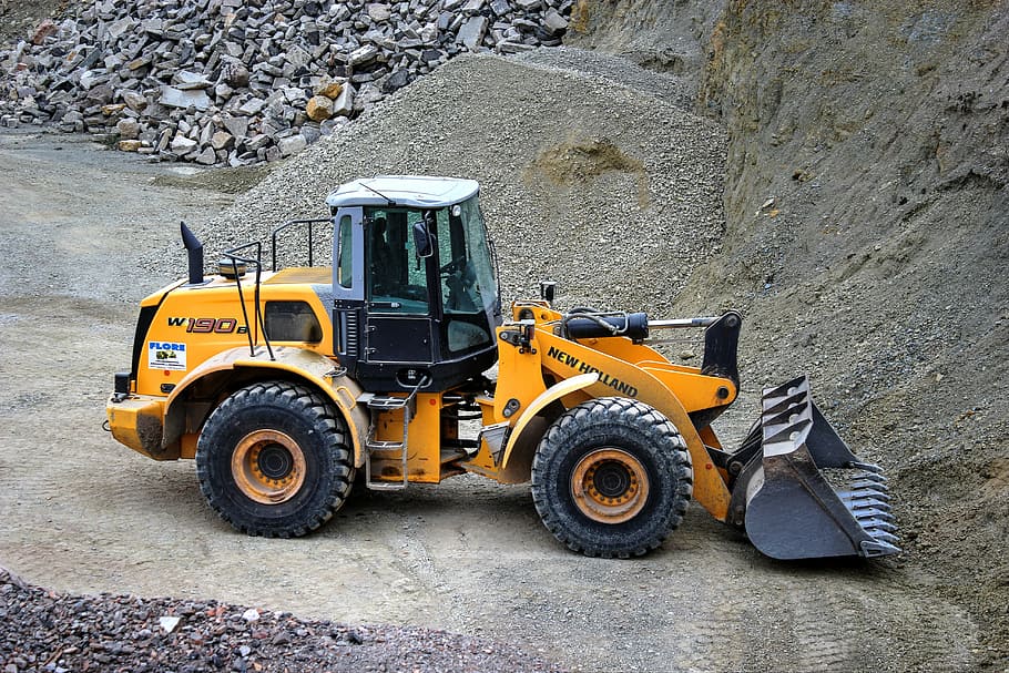 yellow, black, new, holland skid loader, wheel loader, quarry, quarry operation, construction vehicle, removal, tipper