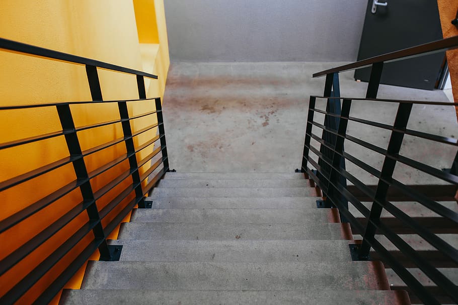 yellow, wall, Staircase, stairway, stairs, handrail, rail, banister, writings, exit