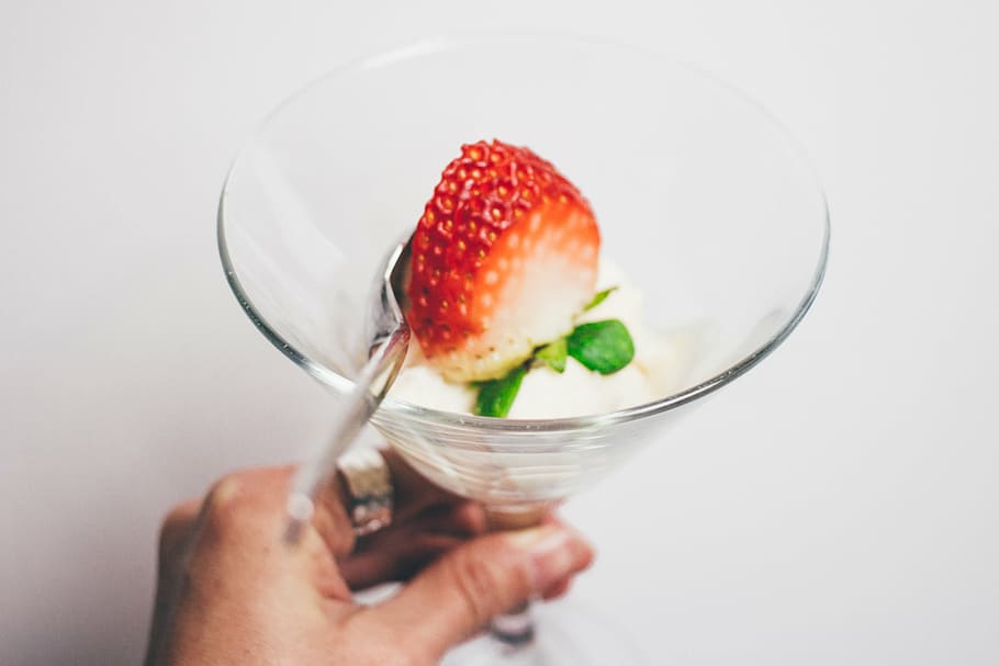 person, holding, drinking glass, strawberry pastry, strawberry, food, crops, fruits, red, juice