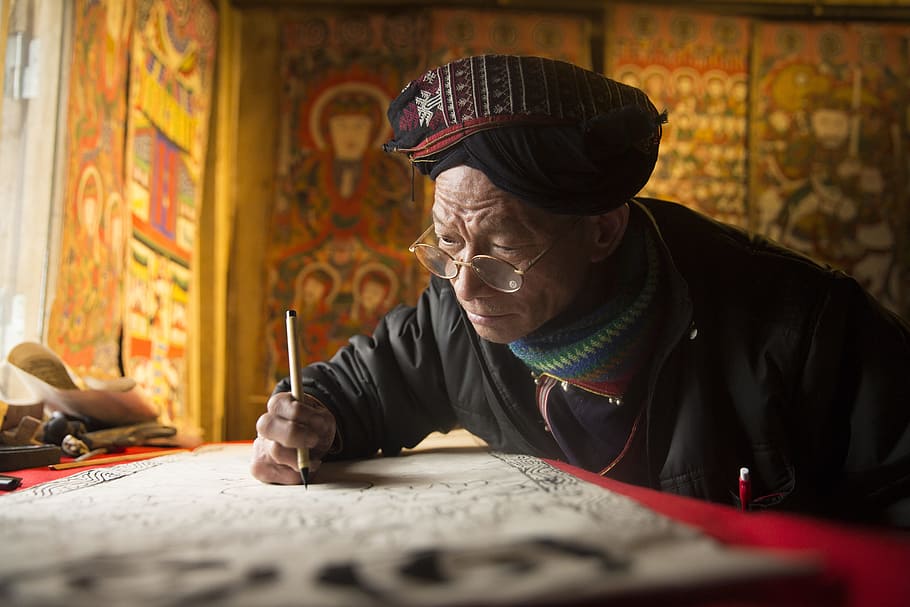 man, wearing, black, jacket, holding, pen, craftsman, painting, the knife, lao cai