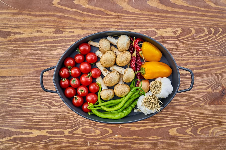 flatlay photography, vegetables, mushrooms, tomato, plate, pot, red, vegan, vegetarian, restaurant