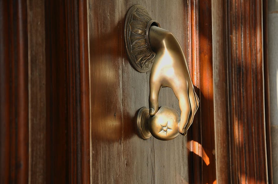 brass-colored arm-designed furniture puller, door, passepartout, gold, wood, iron, old door, old, rustic, bronze
