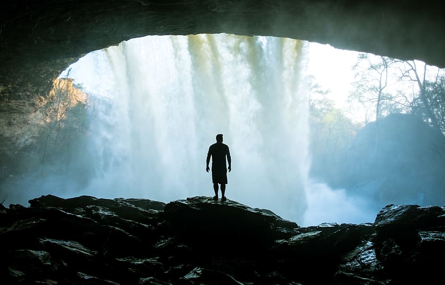 silhouette, man, standing, cave, fronting, water, falls, people, alone, rocks