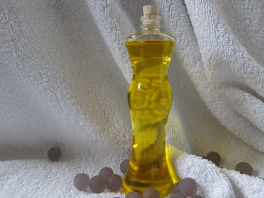 clear, glass bottle, white, fleece textile, bath oil, oil, natural, skin care, aromatherapy, spa