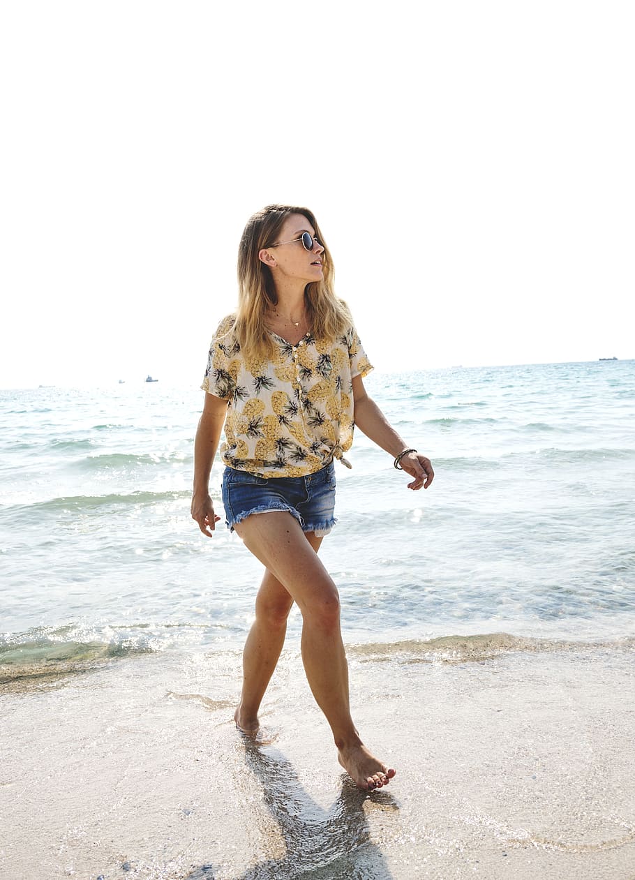woman, wearing, beige, pineapple print shirt, walking, seashore, calm, dom, location, travel