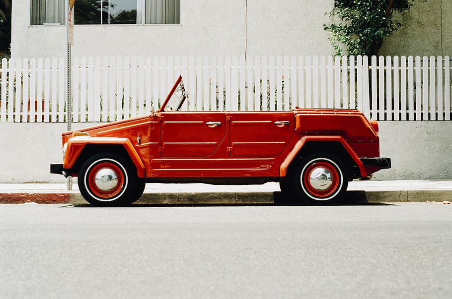 red, volkswagen thing, convertible, parked, white, fence, daytime, orange, car, front