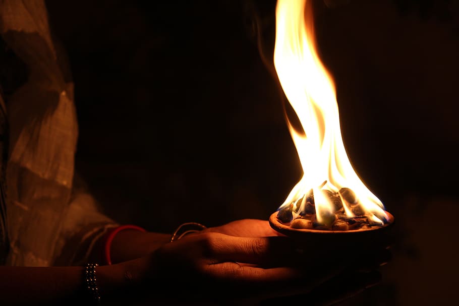 man, holding, cup, charcoal fire, diya, light, flame, celebration, diwali, deepavali