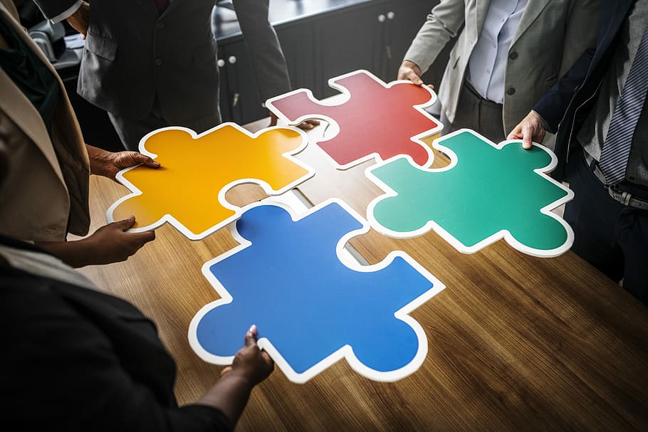 four, persons, holding, yellow, red, green, blue, puzzles, business, business people