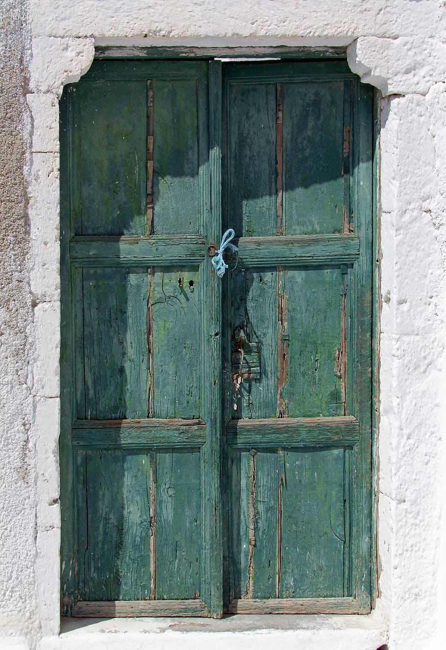 closed, two, teal, wooden, 3-panel, 3- panel doors, door, old, wood, weathered
