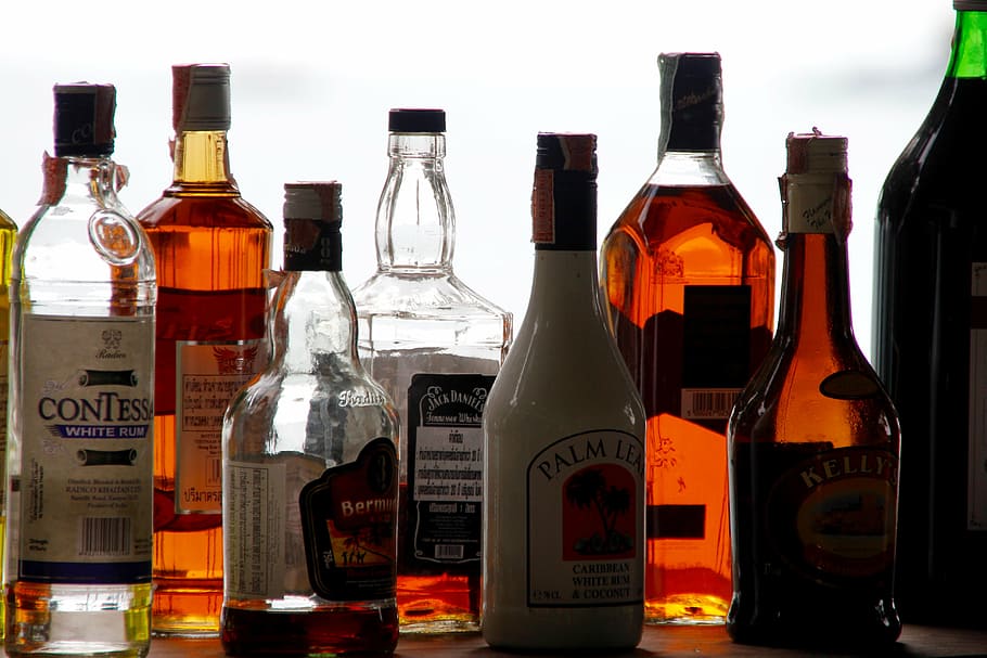 assorted-brand liquor bottle lot, alcohol, bottles, counter, bar, alcoholic, brandy, beverages, drink, cork