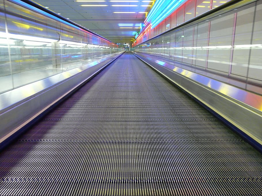 escalator pathway, metal segments, moving walkway, roller platform, treadmill, moving sidewalk, rolling pavement, means of rail transport, escalator, neon