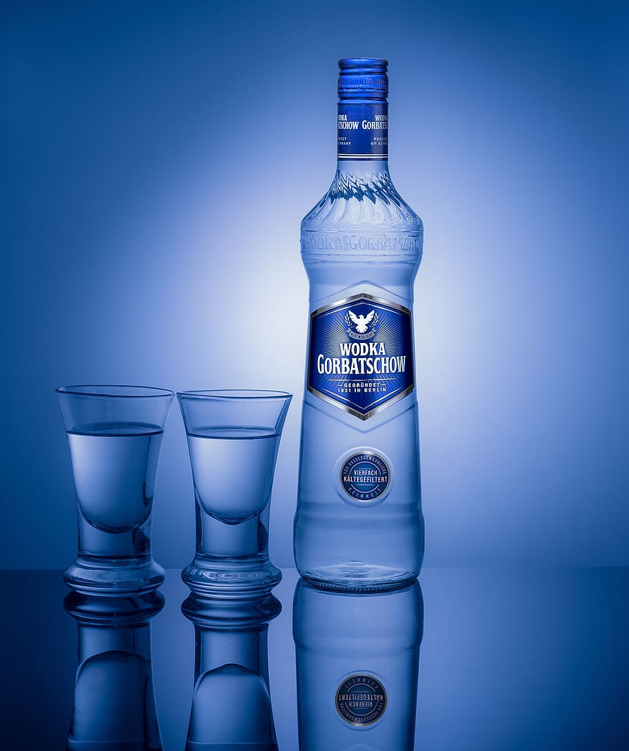 vodka, bottle, glasses, mirroring, studio shot, colored background, blue, indoors, container, still life
