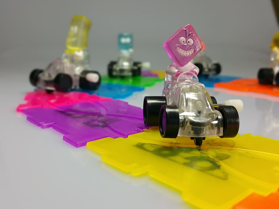 racecourse, racing car, figures, colorful, children, funny, close-up, indoors, studio shot, multi colored