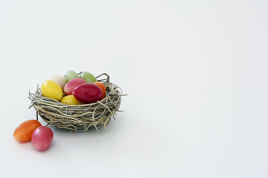 white, wicker birds nest, assorted-color eggs, easter nest, nest, sugar eggs, colorful, easter, decoration, happy easter