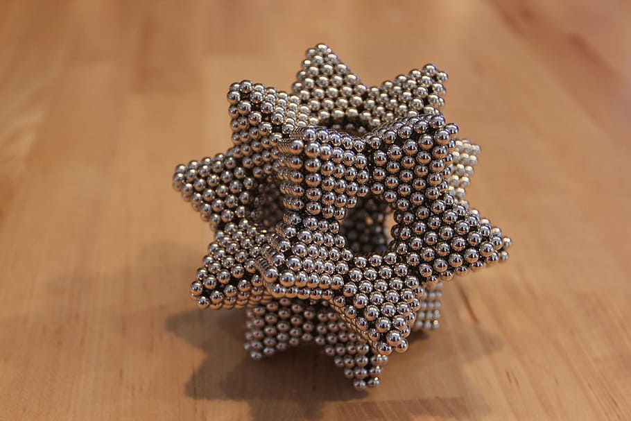 silver magnets, magnetic ball, star, magnet, 3d, wood - Material, table, indoors, close-up, high angle view