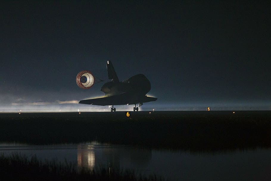 space shuttle atlantis landing, drag chute, deployed, runway, night, parachute, astronaut, mission, complete, airplane