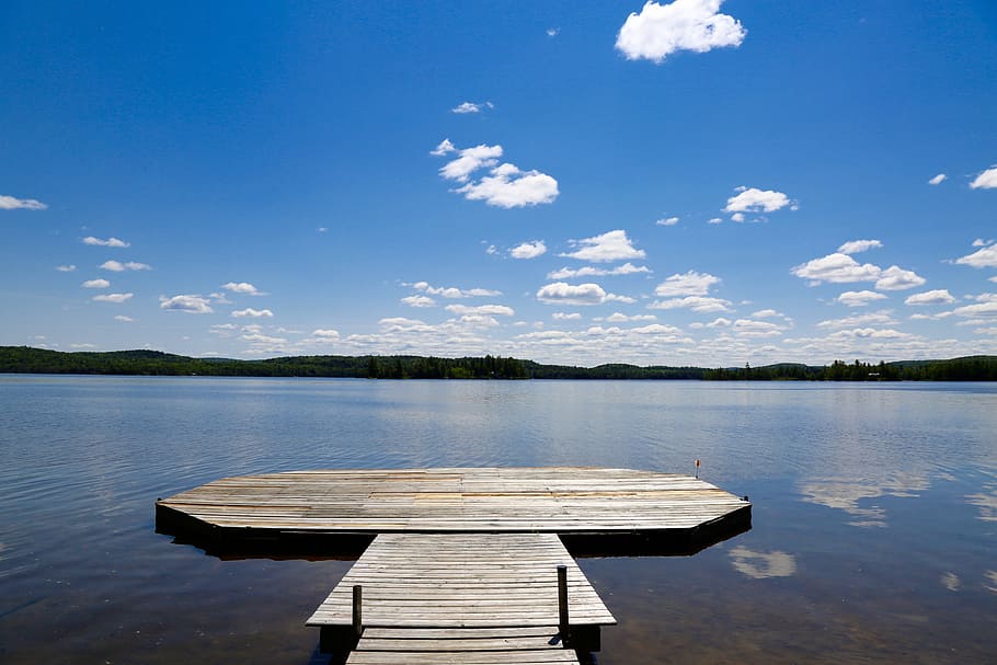 Brown wooden dock on body of water during daytime photo – Free