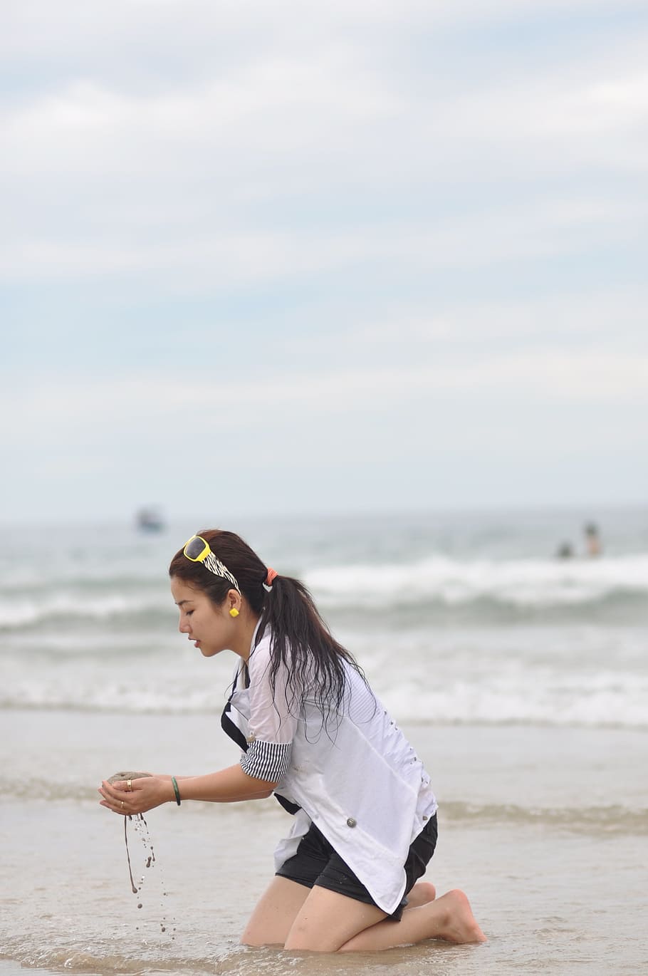 woman kneeing, shore, holding, water, sand, daytime, Girl, Beach, Sad, Summer, Vacation