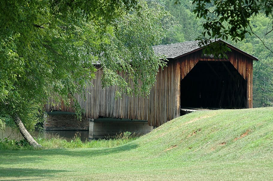 brown, wooden, tunnel, body, water, day, covered bridge, landmark, historic, structure