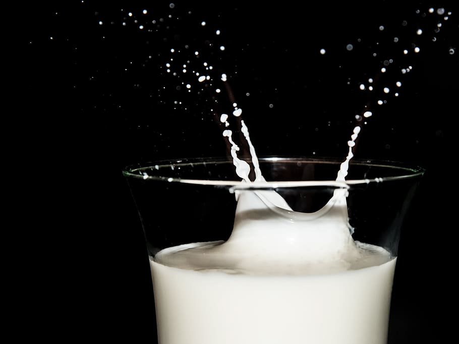 person, taking, white, liquid, clear, drinking glass, macro shot, milk, high speed, high-speed photo