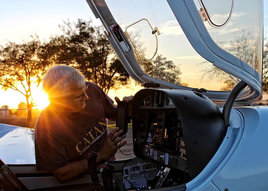 people, old, man, working, aircraft, cockpit, trees, plant, sunset, sunrise