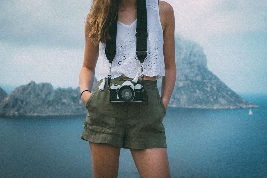 woman, mirrorless camera, girl, photographer, camera, lens, shorts, tank top, one person, midsection