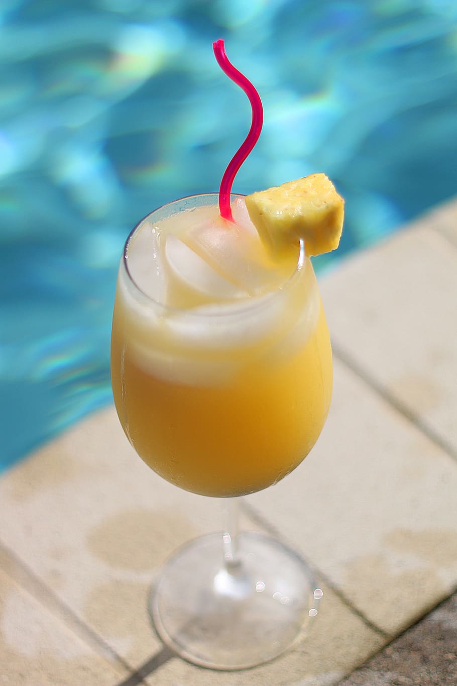 clear, long-stemmed, wine glass, filled, yellow, liquid, summer, cocktail, mimosa, drink