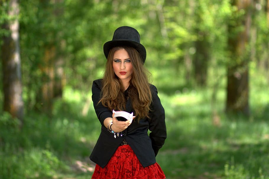 shallow, focus photography, woman, wearing, black, formal, coat, hat, standing, middle