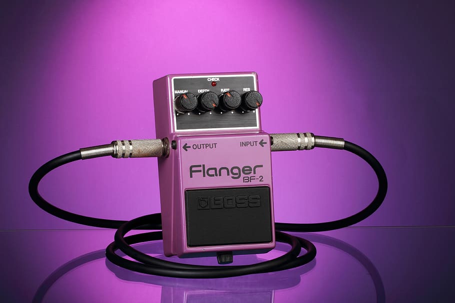 guitar pedal, effects pedal, flanger, stomp box, music, rock, colored background, studio shot, indoors, pink color